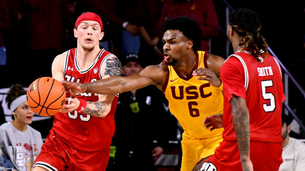 Feb 15, 2024; Los Angeles, California, USA; Southern California Trojans guard Bronny James (6) knocks the ball away from Utah Utes guard Gabe Madsen (55) during the second half at Galen Center. Mandatory Credit: Alex Gallardo-USA TODAY Sports